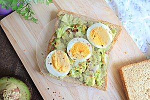 Egg and avocado toast. Top view tost