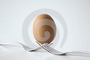 Egg balanced between two forks