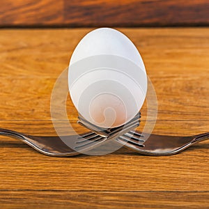 Egg balancing by two forks