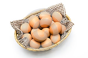 Egg in a basket with brown cloth.