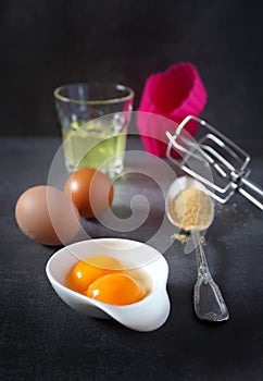 Egg beater, eggs and silicone baking dish