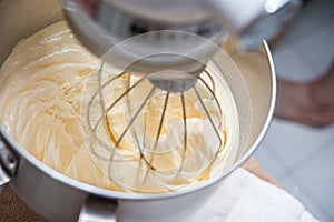 Egg being mix in mixing machine resulted in flour cream