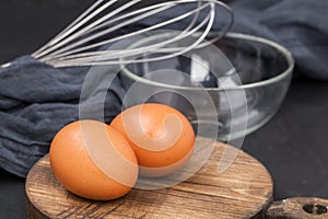 Egg, bowl on wooden chopping