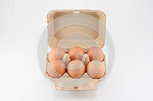 Egg box - eggs in an egg carton on white background.