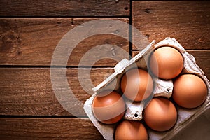 Egg box on a rustic wooden board