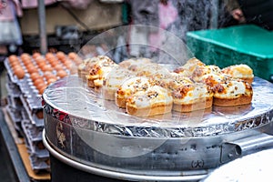 Egg bread with almond, peanut and sunflower seed at Myeong-dong street food, Seoul, South Korea photo