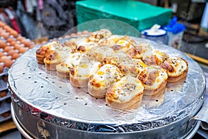 Egg bread with almond, peanut and sunflower seed at Myeong-dong street food, Seoul, South Korea photo