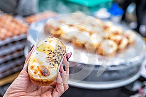 Egg bread with almond, peanut and sunflower seed at Myeong-dong street food, Seoul, South Korea photo