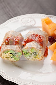 Egg Burritos with fruit vertical shot