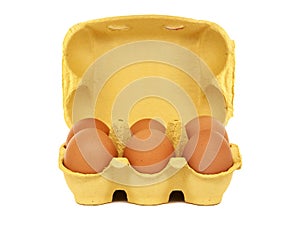 Egg carton with six brown eggs isolated on white background