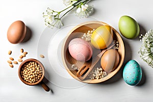 Egg-citing Easter: Colorful Eggs and Gypsophila on White Background Top View