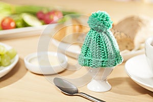 Egg cosy on breakfast table