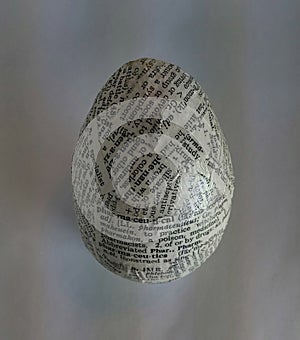 Egg decorated using newspaper decoupage