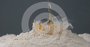 Egg Falling on Flour