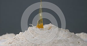 Egg Falling on Flour