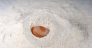 Egg Falling on Flour