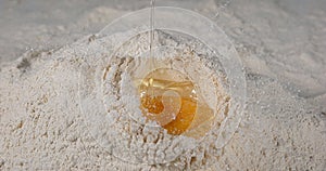 Egg Falling on Flour
