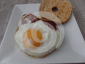 Egg, ham and avocado bagel