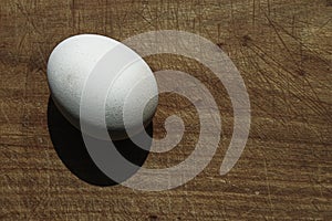 Egg on hard wooden board