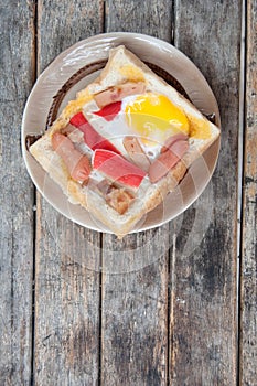 Egg, hotdog and crab stick in a hole