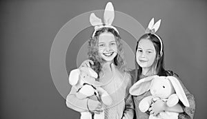 Egg hunt. Family and sisterhood. Spring holiday party. Little girls with hare toy. Happy easter. Children in rabbit