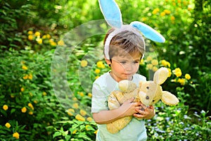 Egg hunt on spring holiday. Little boy child in green forest. love easter. Family holiday. Happy easter. Childhood