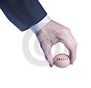 Egg with inscription Career between fingers. Concept of the crisis