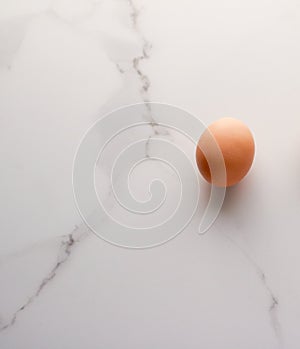 Egg on marble table as minimalistic food flat lay, top view food brand photography flatlay and recipe inspiration for cooking blog