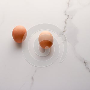 Egg on marble table as minimalistic food flat lay, top view food brand photography flatlay and recipe inspiration for cooking blog