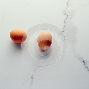 Egg on marble table as minimalistic food flat lay, top view food brand photography flatlay and recipe inspiration for cooking blog