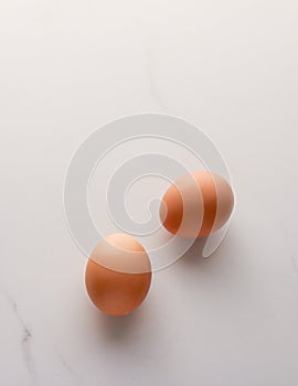 Egg on marble table as minimalistic food flat lay, top view food brand photography flatlay and recipe inspiration for cooking blog