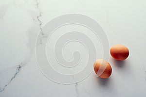 Egg on marble table as minimalistic food flat lay, top view food brand photography flatlay and recipe inspiration for cooking blog