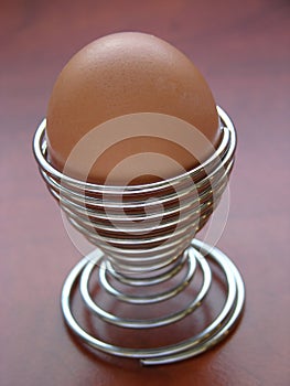Egg in metal spiral eggcup