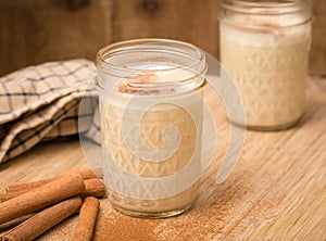 Egg nog in a jar with rustic setting