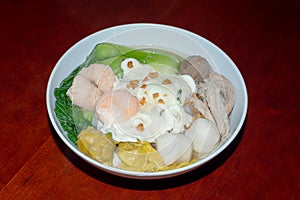 Egg noodle with barbecue pork and wanton in the soup