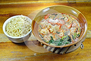 Egg noodle and Chinese pork dumpling in spicy soup