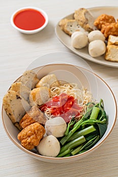 Egg noodles with fish balls and shrimp balls in pink sauce, Yen Ta Four or Yen Ta Fo