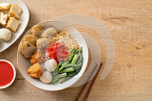 Egg noodles with fish balls and shrimp balls in pink sauce, Yen Ta Four or Yen Ta Fo