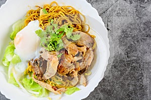 Egg noodles served dry with roasted honey chicken and soft-boiled eggs onsen tamago eggs