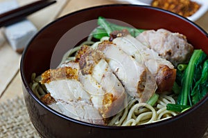 Egg noodles with vegetables and crispy pork ,selection focus