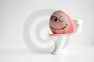 An egg with a painted face. Cute egg. Photo