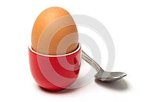 Egg in cup isolated on white background