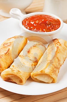 Egg rolls with tomato sauce