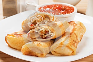 Egg rolls with tomato sauce