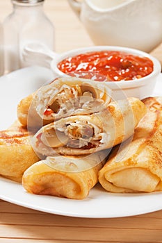 Egg rolls with tomato sauce