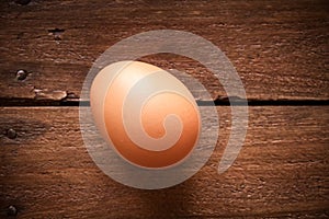 Egg on a rustic wooden board