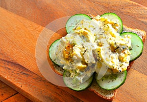 Egg Salad Sandwich for lunch on ironwood cutting board