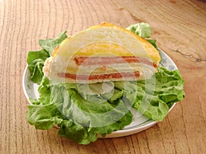 Egg sandwich with ham and lettuce