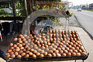 Egg scrambled mix with seasoning on antique old stove for grilled or roasted for sale travelers thai people travel visit at local