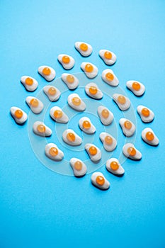Egg shaped marmalade candies background. Overhead view